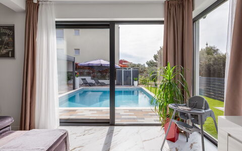 Giny: Swimming Pool, Interior Design, Furniture, Flooring, Home, Floor, Composite Material, Resort, Outdoor Furniture, Shade