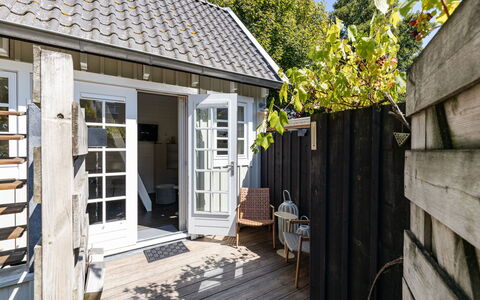 Residence Domburg: Wood, Door, Home, Composite Material, Cottage, Flowerpot, Deck, Outdoor Furniture, Hardwood, Porch