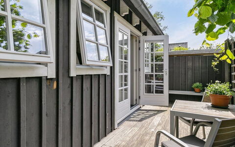 Residence Domburg: Wood, Door, Home, Furniture, Composite Material, Hardwood, Plank, Deck, Wood Stain, Chair
