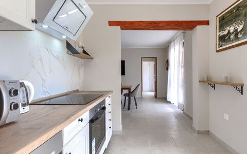 Santina: Furniture, Flooring, Interior Design, Countertop, Wood, Ceiling, Floor, Cabinetry, Room, Kitchen