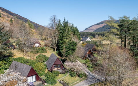 Sandpiper Lodge: Tree, Leaf, Mountainous Landforms, Vegetation, House, Shrub, Landscape, Highland, Hill
