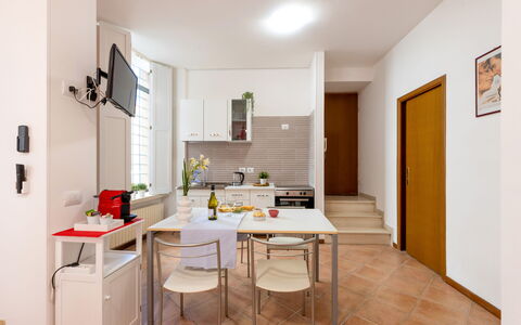 Movie Suite Jesi: Furniture, Interior Design, Wood, Flooring, Kitchen, Floor, Chair, Room, Table, Kitchen Appliance