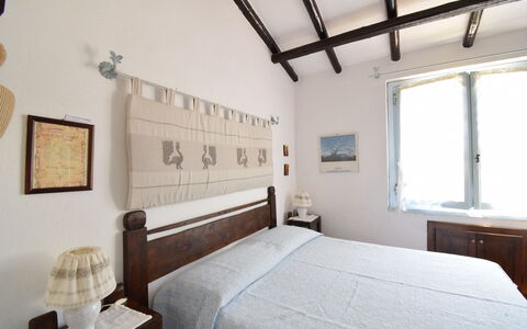 Villetta Oasi Belvedere, Budoni, Wifi, Ac: Furniture, Wall, Bedroom, Wood, Bed, Interior Design, Floor, Flooring, Home, Bed Sheet