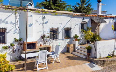 Paraje Starlight Murtas - Alpujarra: Flowerpot, Garden, Cottage, Houseplant, Backyard, Landscaping, Chair, Yard, Hacienda, Patio