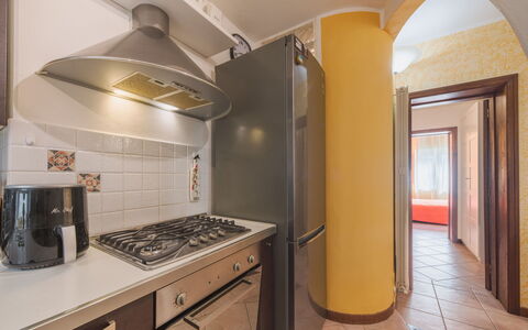 Appartamento Brezza Marina: Flooring, Interior Design, Kitchen, Major Appliance, Floor, Ceiling, Countertop, Kitchen Appliance, Room, Lighting
