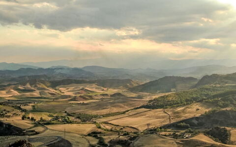 Centro: Mountainous Landforms, Mountain, Hill, Highland, Natural Landscape, Horizon, Ecoregion, Terrain, Landscape, Cloud