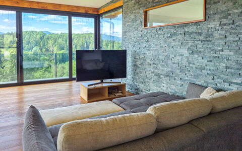 Villa Techelsberg: Flooring, Interior Design, Couch, Living Room, Wood Flooring, Stone Wall, Hardwood, Wood Stain, Chair