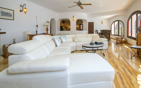 Casela: Furniture, Couch, Flooring, Interior Design, Floor, Wood, Living Room, Ceiling, Wood Flooring