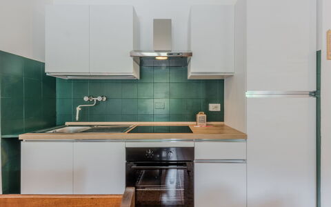 La Casa dei Frassini: Kitchen Appliance, Kitchen, Countertop, Major Appliance, Cabinetry, Interior Design, Flooring, Wood, Home Appliance, Kitchen Stove