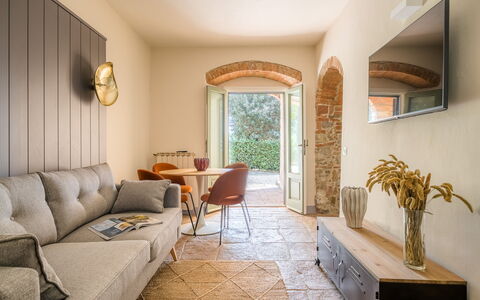 Passignano: Furniture, Wall, Interior Design, Flooring, Couch, Floor, Lighting, Living Room, Table, Room