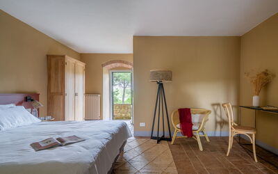 Relais Badia a Passignano - Appartamento Pinot Ner: Furniture, Interior Design, Bedroom, Wood, Bed, Bed Sheet, Flooring, Floor, Bedding, Room