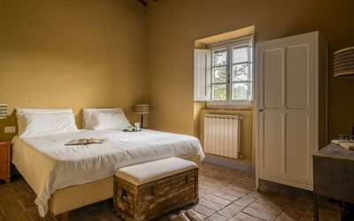 Relais Badia a Passignano - Appartamento Cabernet: Wall, Flooring, Bedroom, Interior Design, Furniture, Floor, Bed, Bed Sheet, Bedding, Room