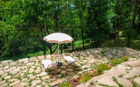 Poderi Alugi Serravalle: Garden, Shade, Outdoor Furniture, Flagstone, Landscaping, Umbrella, Backyard, Cobblestone