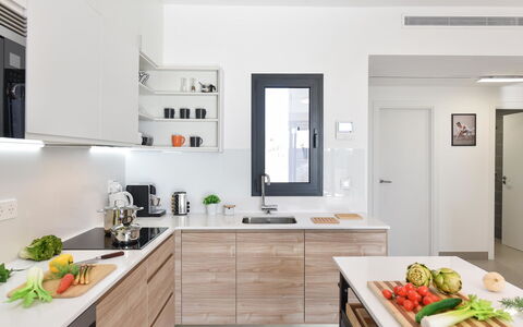 Las Yucas 2: Countertop, Kitchen, Furniture, Kitchen Appliance, Cabinetry, Interior Design, Wood, Major Appliance, Flooring, Home Appliance