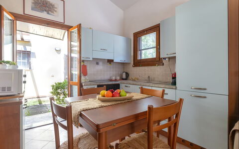 Oleandri: Furniture, Wood, Flooring, Kitchen, Interior Design, Kitchen Appliance, Countertop, Floor, Major Appliance, Cabinetry