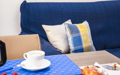 Suite Acquamare: Furniture, Textile, Couch, Cushion, Throw Pillow, Linens, Living Room, Pillow, Serveware