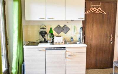 Studio Esche 1 651.1: Kitchen, Kitchen Appliance, Furniture, Major Appliance, Cabinetry, Wood, Countertop, Interior Design, Kitchen Sink, Flooring