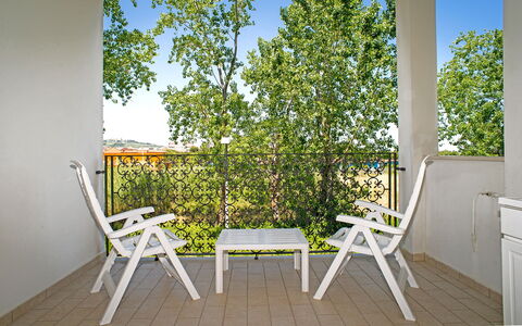 Tortoreto Apartment Close To The Sea, Ac,wi -fi: Furniture, Chair, Outdoor Furniture, Porch, Balcony, Outdoor Table, Shade, Folding Chair, Deck, Wood Stain