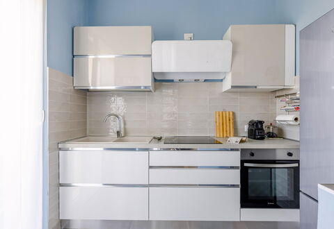 Altamarea Apartment: Kitchen Appliance, Kitchen, Cabinetry, Countertop, Major Appliance, Flooring, Furniture, Interior Design, Wood, Home Appliance