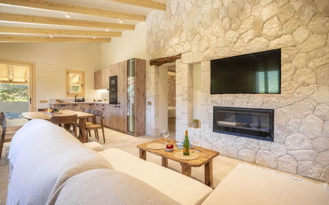 Petit Can Garcia: Wall, Flooring, Wood, Interior Design, Furniture, Floor, Stone Wall, Ceiling, Couch, Living Room