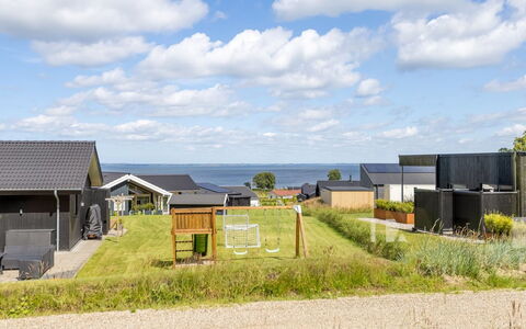 Heidie - 600M from the Sea: Roof, House, Home, Cottage, Siding, Estate, Driveway, Garden Buildings, Yard, Shed