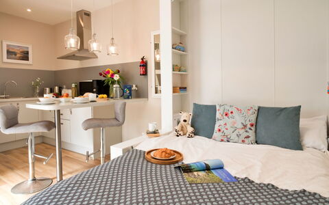 The Hideaway: Furniture, Interior Design, Flooring, Floor, Room, Textile, Bedroom, Lighting, Bed, Apartment