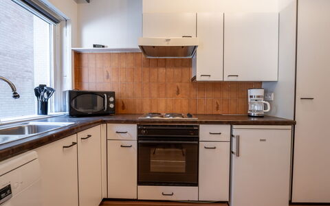 Sealing with Balcony: Kitchen, Countertop, Kitchen Appliance, Major Appliance, Cabinetry, Kitchen Sink, Flooring, Sink, Plumbing Fixture, Interior Design