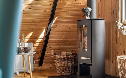 Annalia - 400M from the Sea: Furniture, Wood-Burning Stove, Hearth, Hardwood, Wood Stain, Chair, Wood Flooring, Houseplant, Living Room