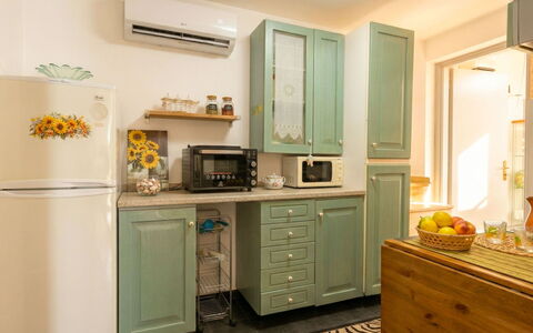 Il Girasole: Cabinetry, Furniture, Kitchen, Interior Design, Kitchen Appliance, Countertop, Wood, Major Appliance, Flooring, Cupboard