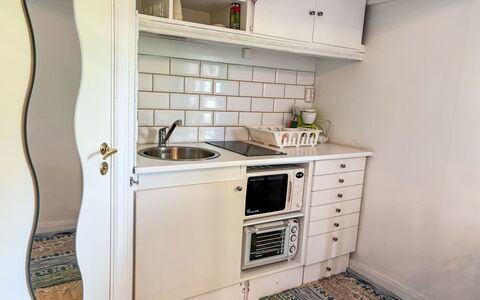 Skyberga Torp Lilla Stugan: Flooring, Wood, Kitchen, Interior Design, Cabinetry, Countertop, Floor, Kitchen Appliance, Major Appliance, Room