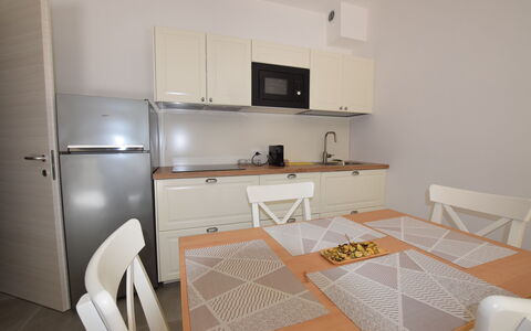 Casa In Collina: Furniture, Interior Design, Flooring, Floor, Wood, Room, Cabinetry, Kitchen, Major Appliance, Lighting
