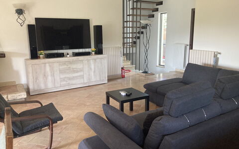 Villa Ginevra: Furniture, Flooring, Interior Design, Floor, Wood, Couch, Living Room, Room, Apartment, Lighting