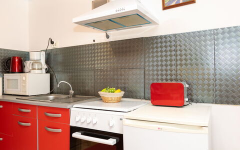 Les Jardins: Kitchen Appliance, Kitchen, Major Appliance, Flooring, Kitchen Stove, Countertop, Interior Design, Home Appliance, Floor, Stove