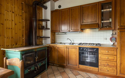 Moncucco Mountain Home: Wood, Kitchen, Interior Design, Flooring, Cabinetry, Countertop, Ceiling, Floor, Furniture, Room