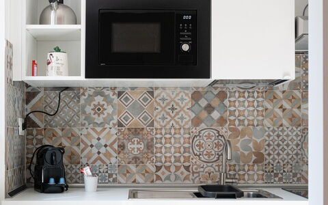 Aselli Home: Kitchen, Flooring, Major Appliance, Kitchen Appliance, Tile, Countertop, Cabinetry, Home Appliance, Small Appliance, Stove