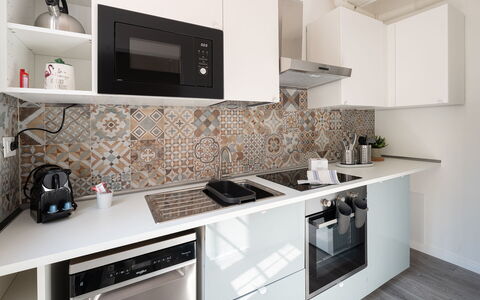 Aselli Home: Kitchen, Countertop, Major Appliance, Flooring, Interior Design, Kitchen Appliance, Floor, Cabinetry, Room, Tile