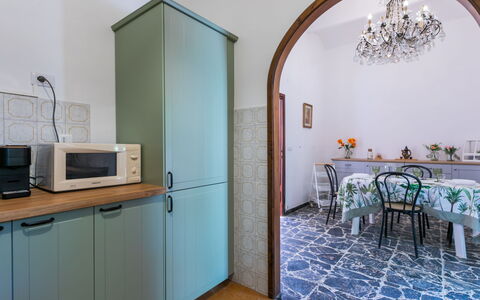 Torre degli Amidei: Flooring, Interior Design, Wood, Floor, Kitchen, Room, Furniture, Lighting, Cabinetry, Countertop