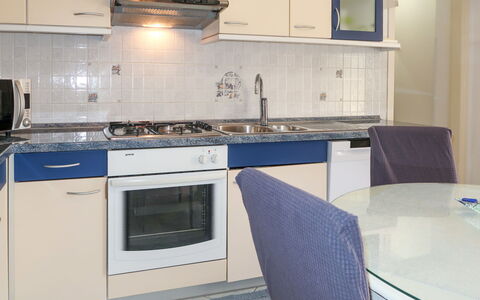 Dina: Kitchen, Kitchen Appliance, Countertop, Major Appliance, Flooring, Cabinetry, Kitchen Stove, Stove, Furniture, Interior Design