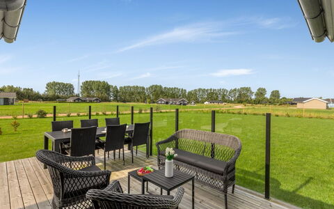 Hellevi - 900M from the Sea: Sky, Land Lot, Outdoor Furniture, Chair, Outdoor Table, Lawn, Hardwood, Shade, Kitchen & Dining Room Table, Deck