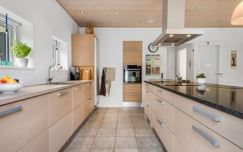 Jyrki - 100M from the Sea: Kitchen, Countertop, Cabinetry, Furniture, Flooring, Interior Design, Kitchen Appliance, Wood, Floor, Light Fixture