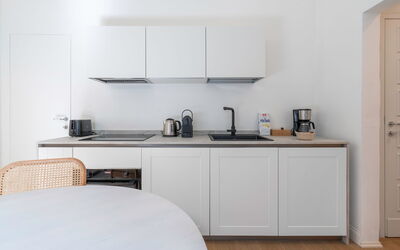 Deservi Elegant Apt. Leonardo: Furniture, Interior Design, Kitchen, Countertop, Cabinetry, Kitchen Appliance, Wood, Flooring, Room, Floor
