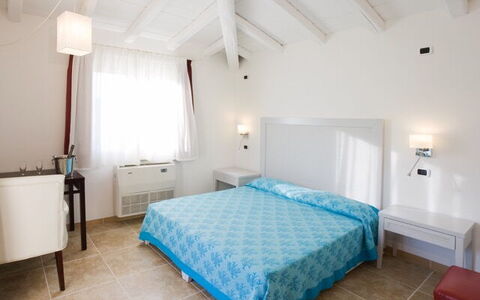 Villa Leccio 1: Furniture, Floor, Flooring, Bedroom, Bed, Resort, Chair, Linens, Bedding, Apartment