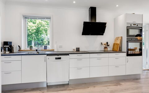 Wolter - 1.7Km from the Sea: Kitchen, Flooring, Kitchen Appliance, Countertop, Cabinetry, Interior Design, Major Appliance, Floor, Wood, Home Appliance