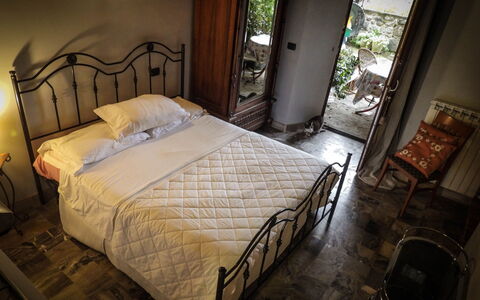 Agriturismo Arcera Apartments: Furniture, Bed, Bedroom, Bedding, Bed Sheet, Interior Design, Floor, Linens, Bed Frame, Flooring