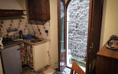 Agriturismo Arcera Apartments: Wall, Door, Wood Stain, Countertop, Kitchen, Hardwood, Kitchen Appliance, Chair, Kitchen Stove, Major Appliance
