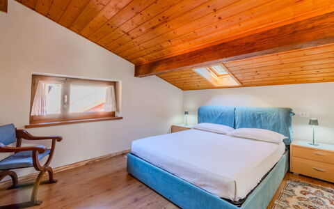 Mansarda in Legno San Rocco: Wood, Interior Design, Bed, Ceiling, Bedroom, Floor, Furniture, Flooring, Room, Home
