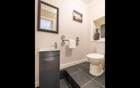 Highland View: Toilet Seat, Bathroom, Toilet, Flooring, Plumbing Fixture, Floor, Interior Design, Bathroom Cabinet, Plumbing, Sink