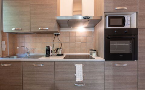 Casa Riggi: Kitchen Appliance, Kitchen, Cabinetry, Countertop, Major Appliance, Furniture, Wood, Home Appliance, Kitchen Sink, Interior Design