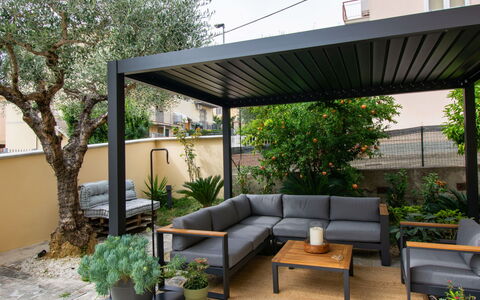 Michelle: Shade, Outdoor Structure, Outdoor Furniture, Pergola, Patio, Garden, Flowerpot, Houseplant, Backyard, Yard