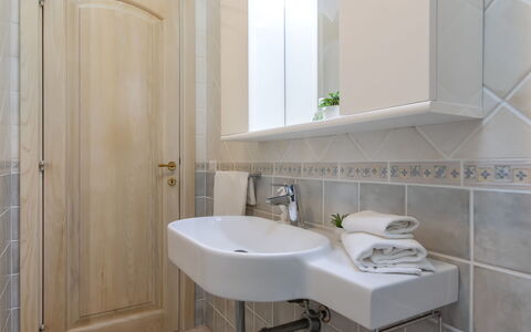 Petra Blu: Bathroom Sink, Bathroom, Sink, Plumbing Fixture, Flooring, Interior Design, Floor, Tap, Mirror, Countertop